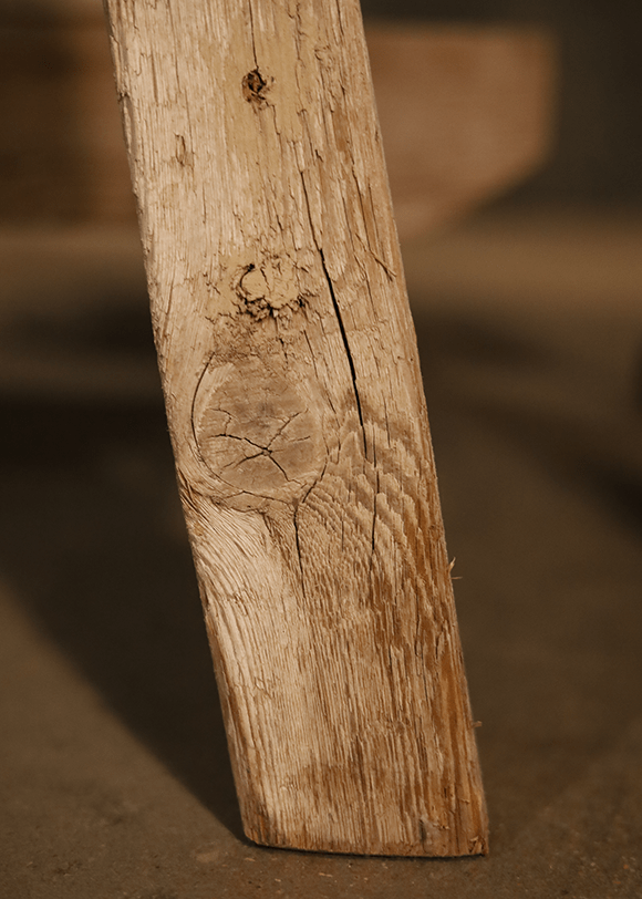 a close up of a wooden object on a table