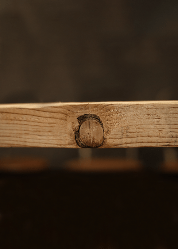 a close up of a piece of wood with a hole in it