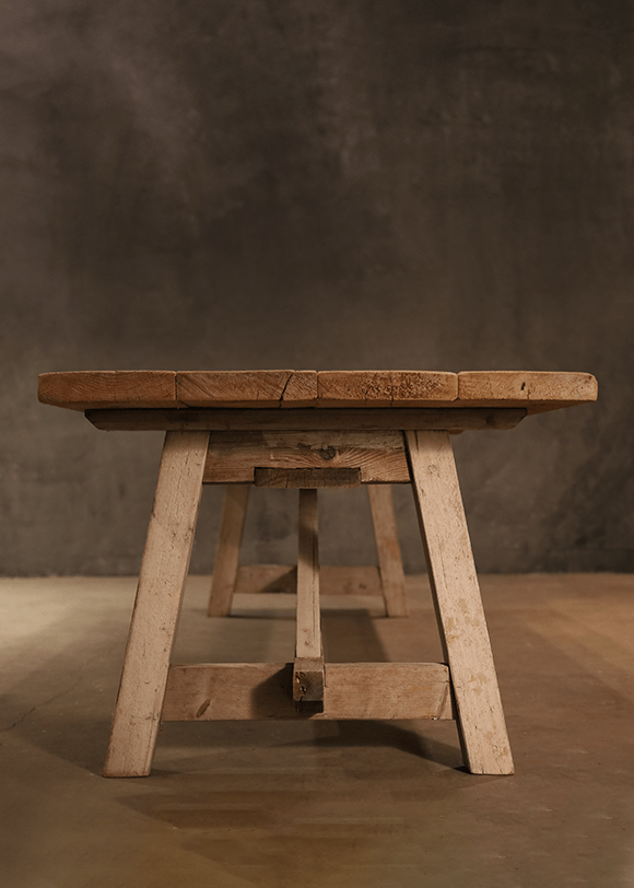 a wooden bench sitting on top of a wooden floor