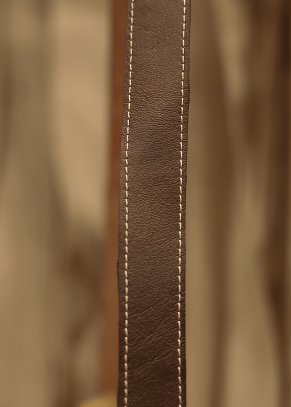 a close up of a brown leather chair