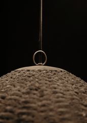 a close up of a ring hanging from a wire