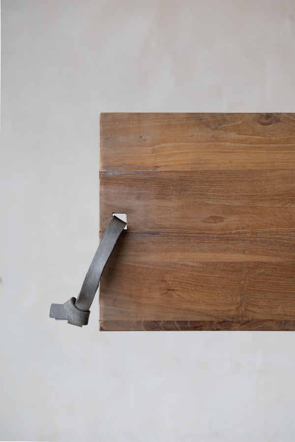 Teakwood cheese board with leather strap. 